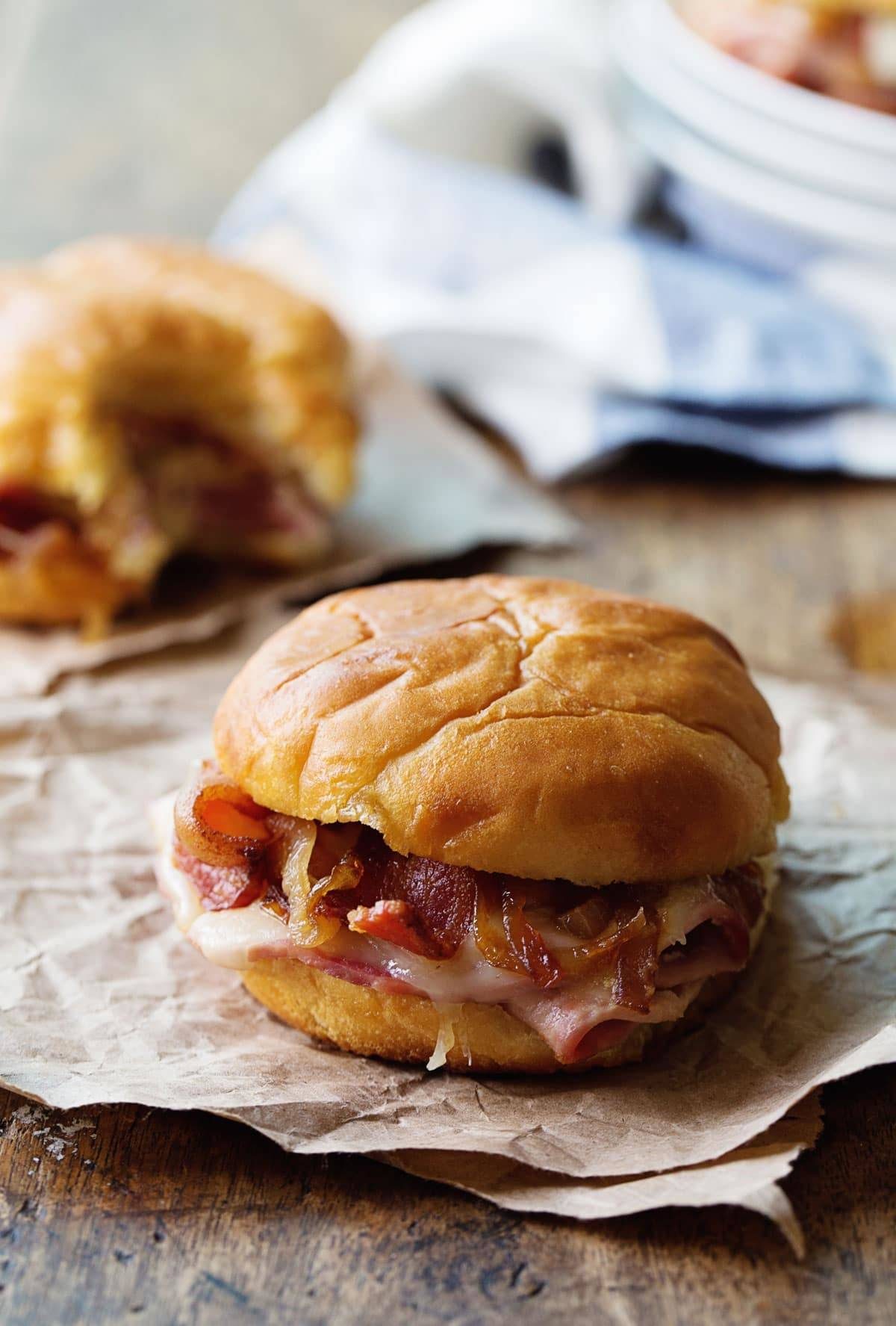 Ham and Cheese Sandwiches on brown paper.