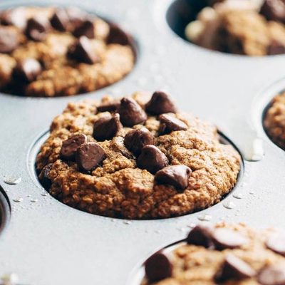 Banana Bread Muffins spread with butter.