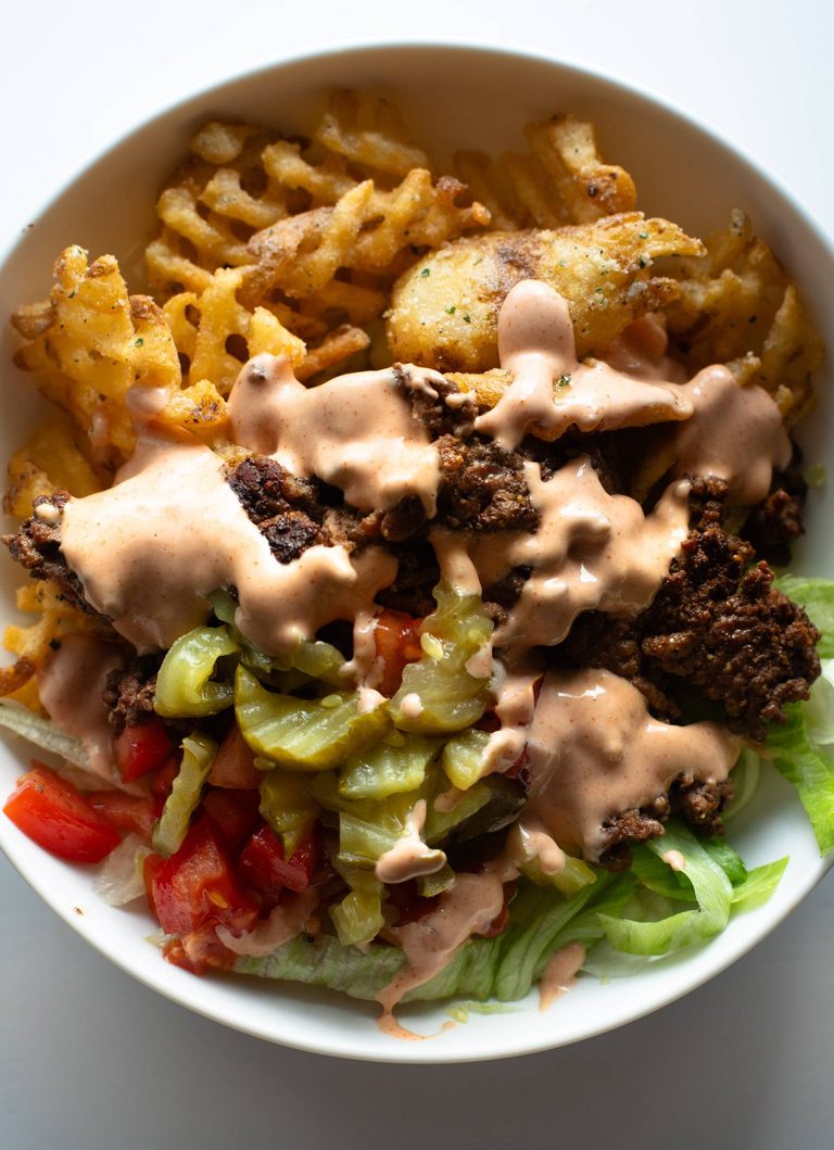 Burger bowl with house sauce on top.
