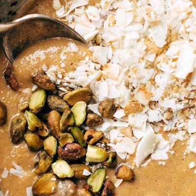 Carrot Cake Smoothie Bowl with coconut and pistachios.
