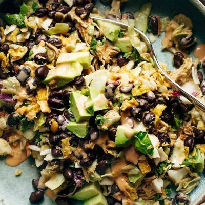 Cheater's Power Salad in bowl with hands.