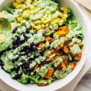 Spicy Southwestern Salad in a serving bowl with avocado dressing.