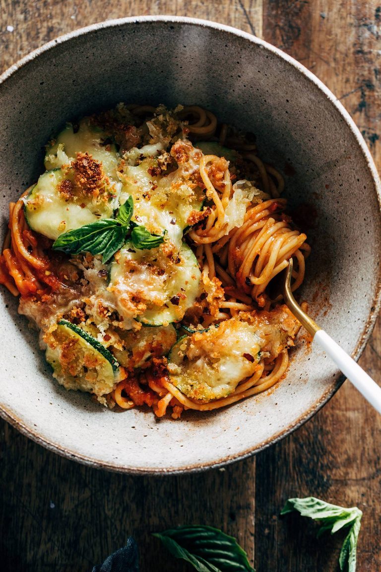 Spaghetti topped with crispy cheesy zucchini.