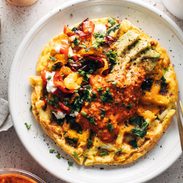 Loaded egg waffle on a plate with toppings