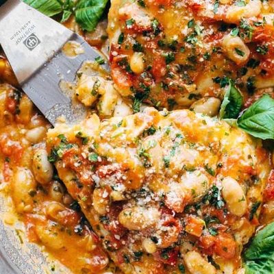 Garlic Basil Barramundi in a skillet with spatula.