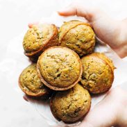 Lemon Zucchini Muffins held by hands.