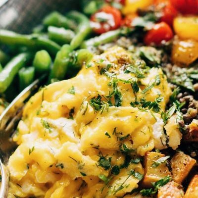 Lentil Bowl with scrambled eggs, potatoes, green beans, and tomatoes.