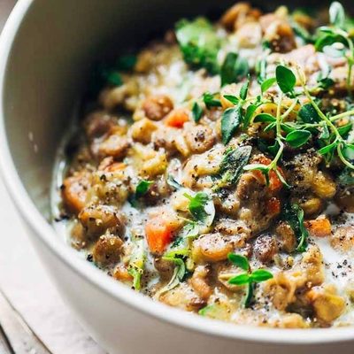 One-Pot Creamy Spinach Lentils in a bowl with spoon.