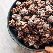 Puppy chow piled in a bowl.