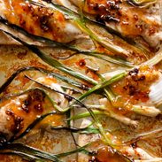 A picture of Apricot Chicken with Charred Scallions