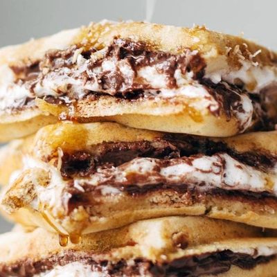 Smores Waffles in a stack with coconut sprinkle.