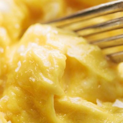 Soft Scrambled Eggs on plate with fork.