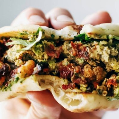Naan-wich held by hand.