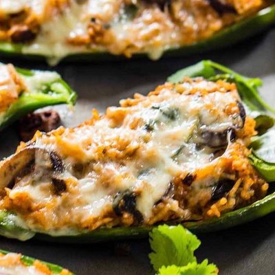Queso Stuffed Poblanos on a sheet pan.
