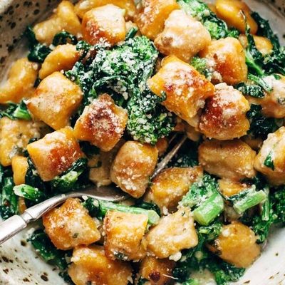 Sweet Potato Gnocchi in bowl with broccoli rabe.