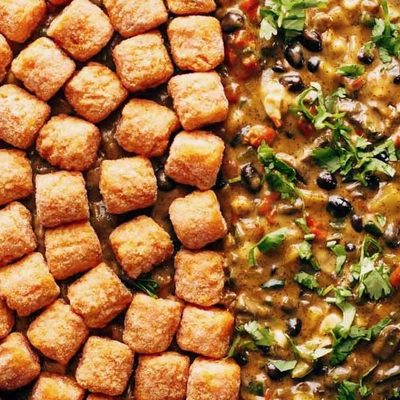 Sweet Potato Tater Tot Hotdish in a skillet before baking.