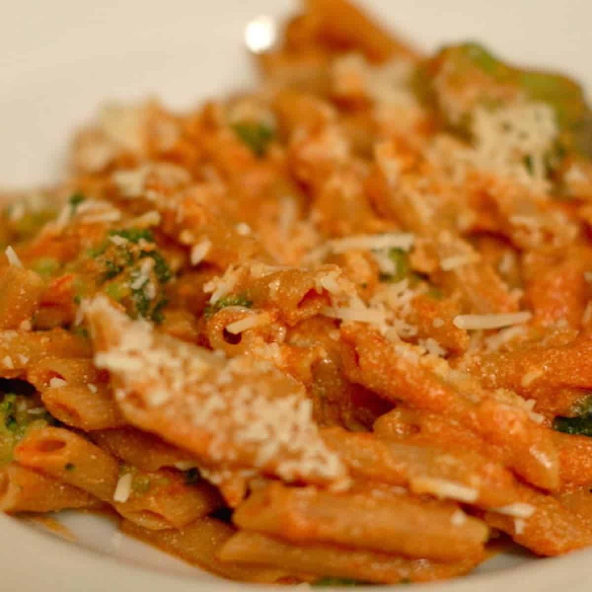 Tomato Ricotta Pasta with Broccoli and cheese shreds.