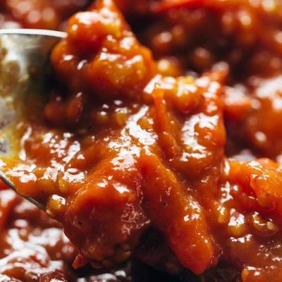 Tomato Butter Sauce in pan with spoon.
