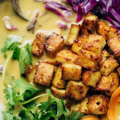 Coconut Curry Soup in a bowl with tofu.