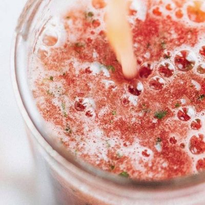 Watermelon Smoothie being poured into a glass.